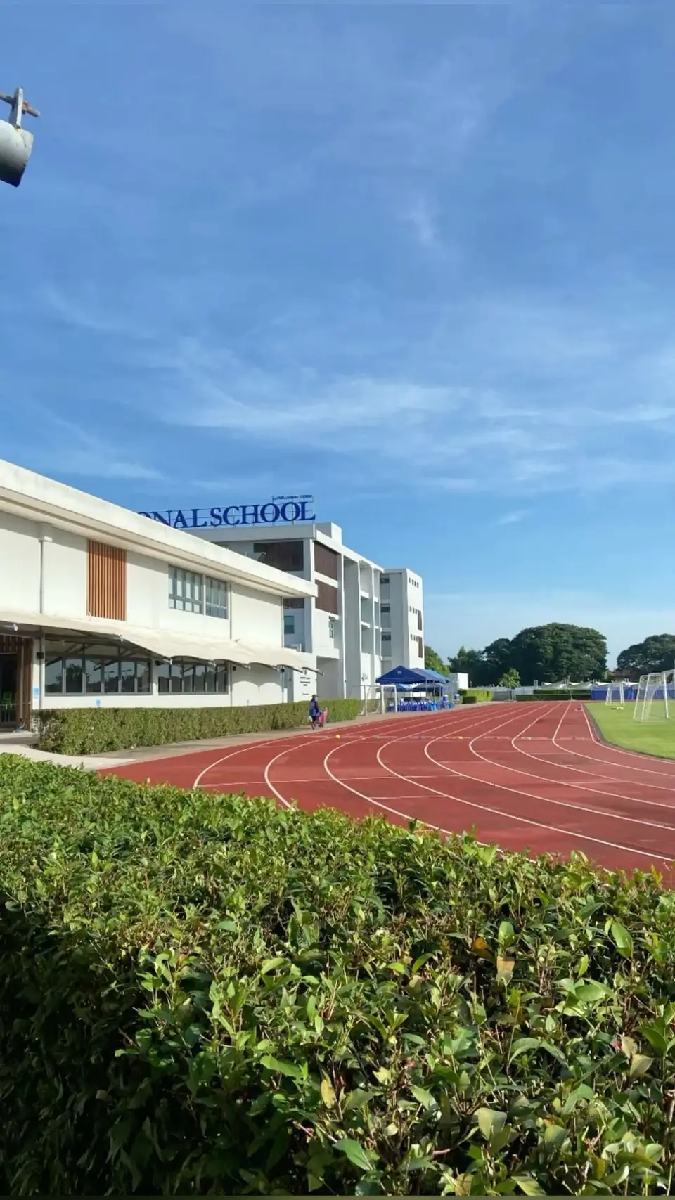 A school building beside a running track